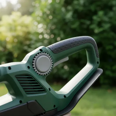 A close-up of a hedge trimmer's rotating handle mechanism, showing it locked in an angled position, demonstrating ergonomic flexibility for trimming